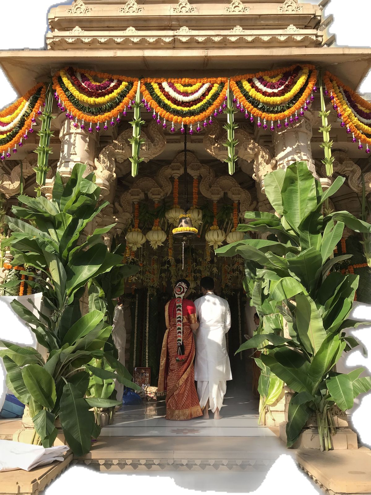 Temple mandap entrance with banana trees